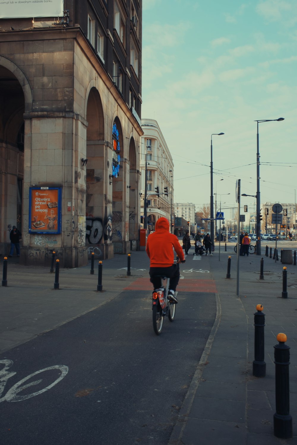 a person riding a bike down a street