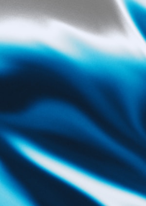 a close up of a blue and white background