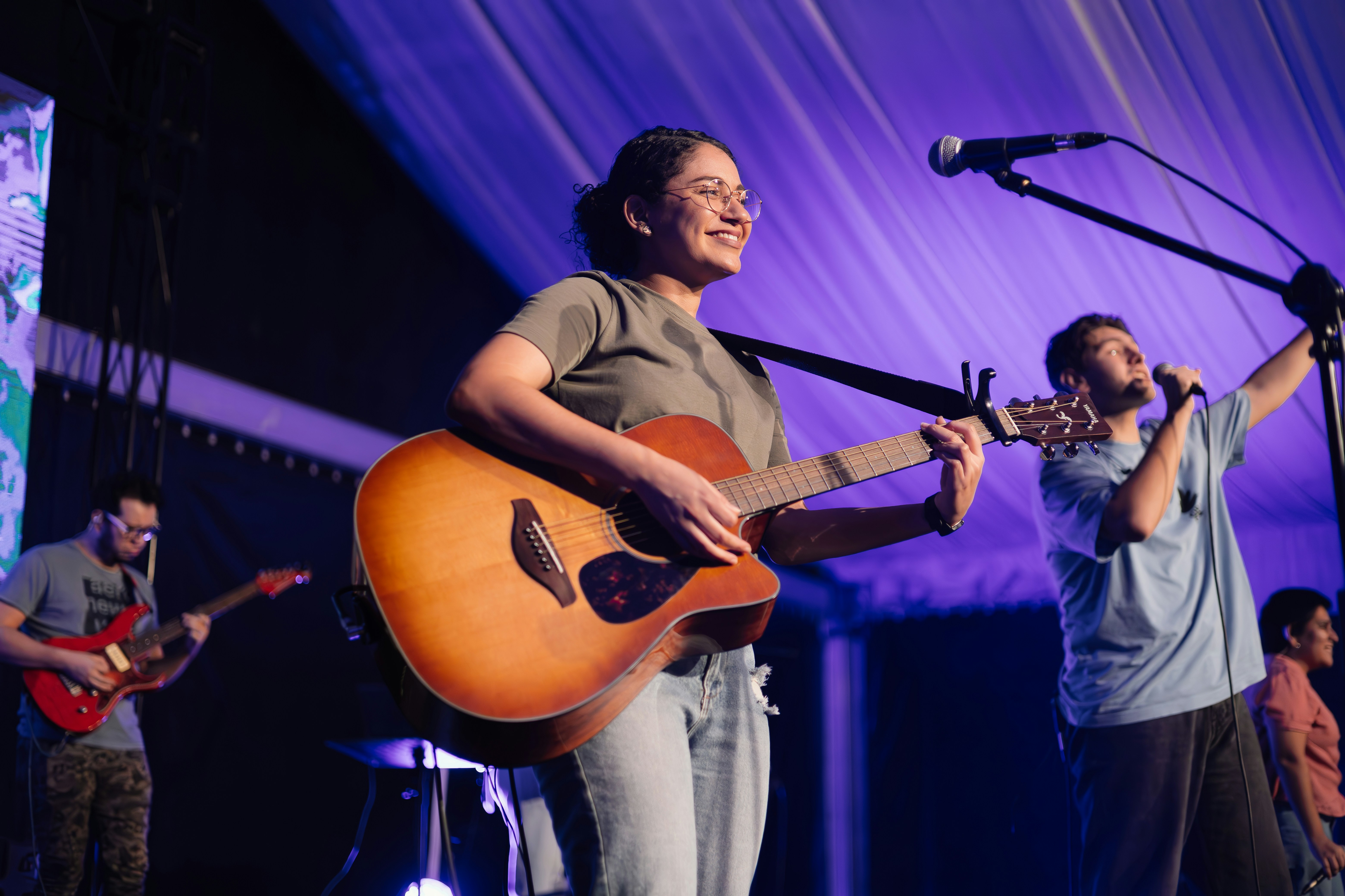 a group of people standing on top of a stage