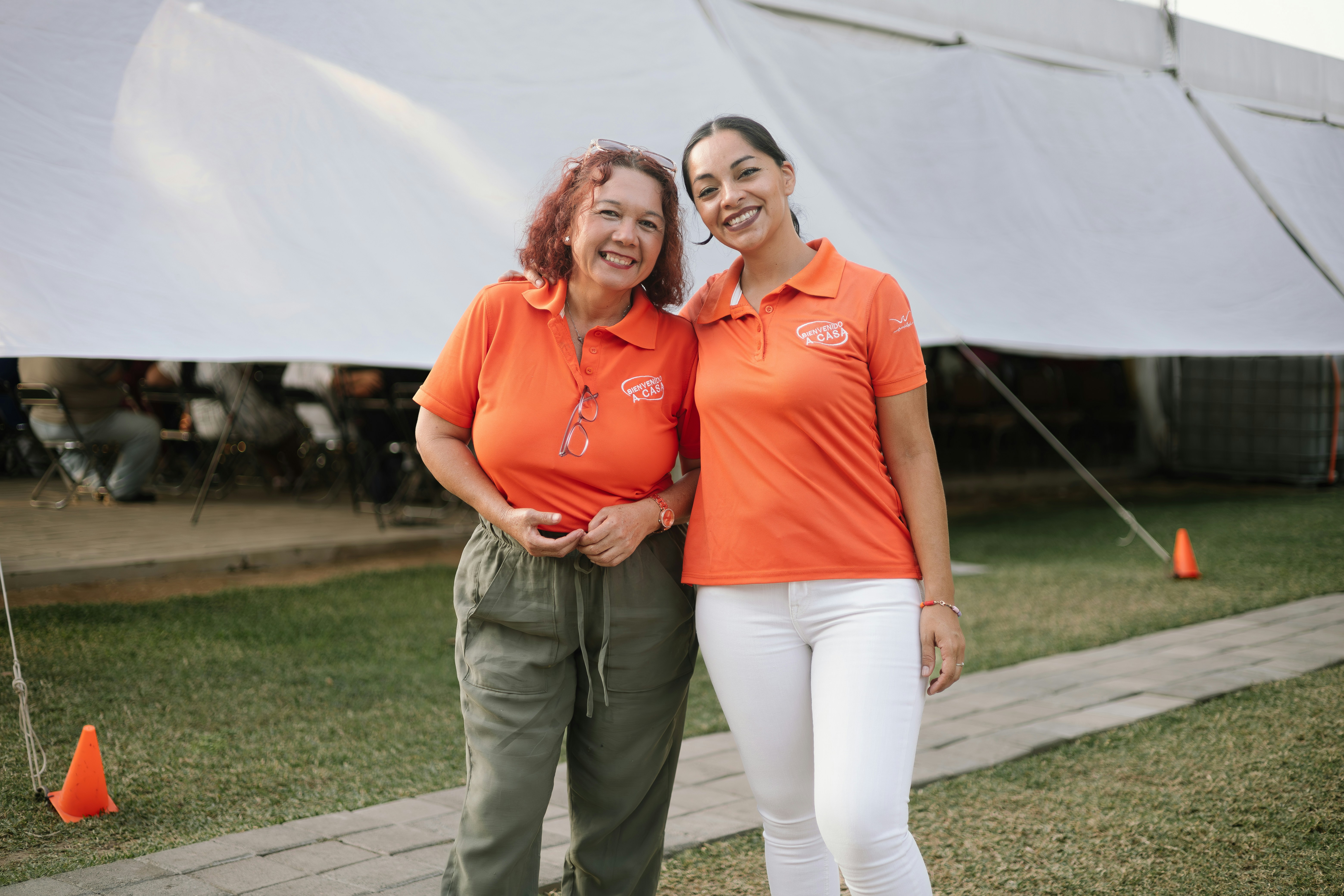 a couple of women standing next to each other