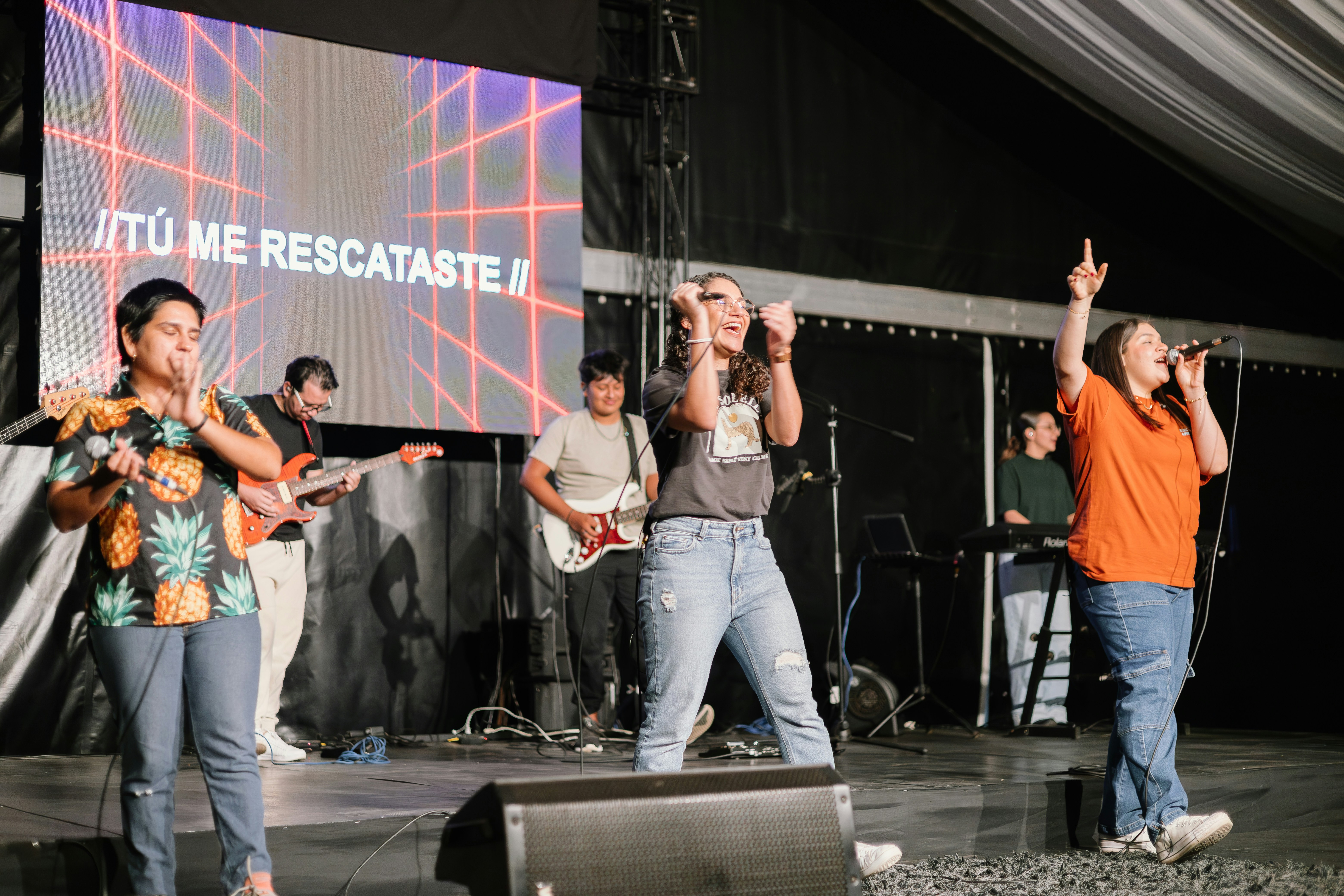 a group of people standing on top of a stage