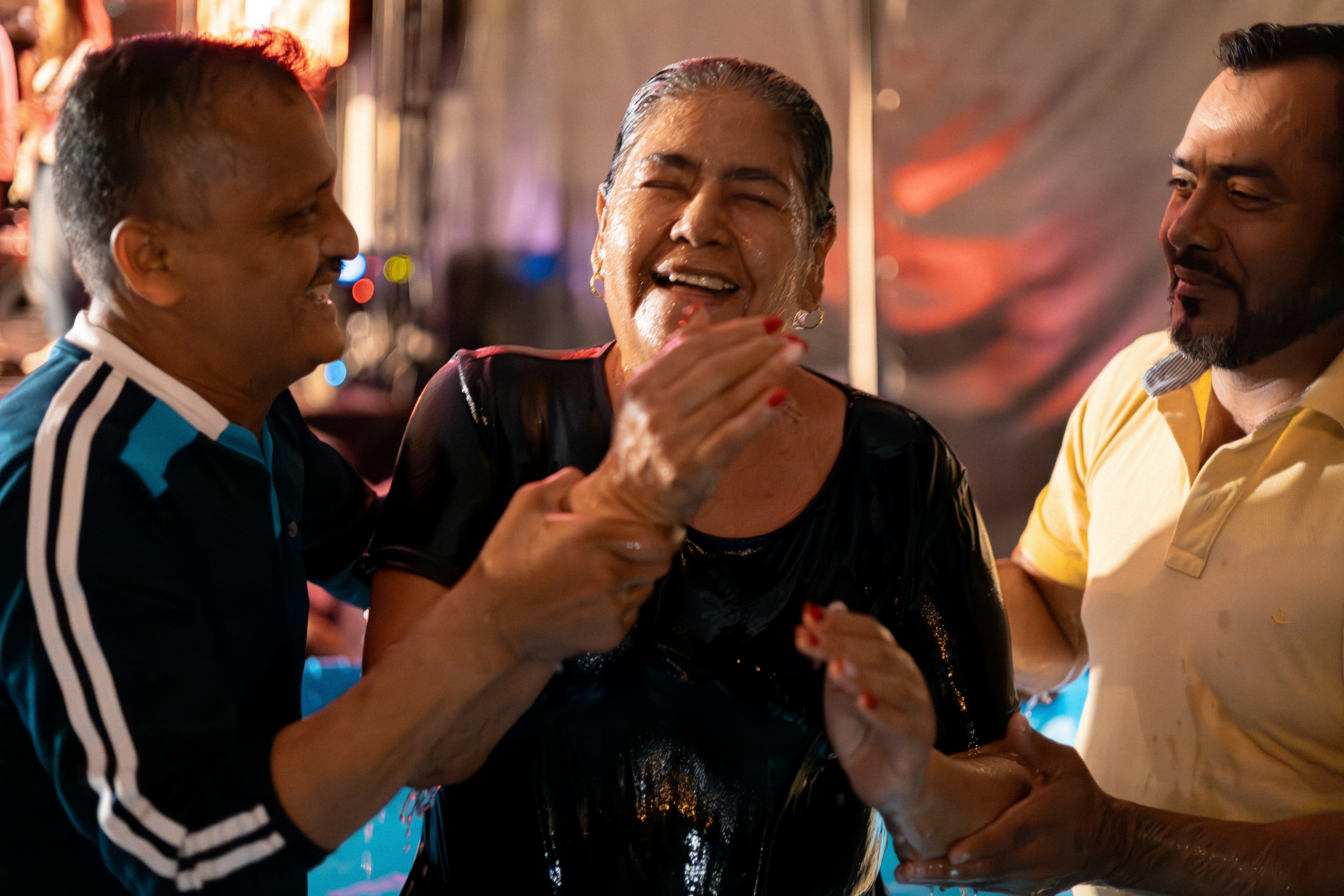 a group of people standing around each other