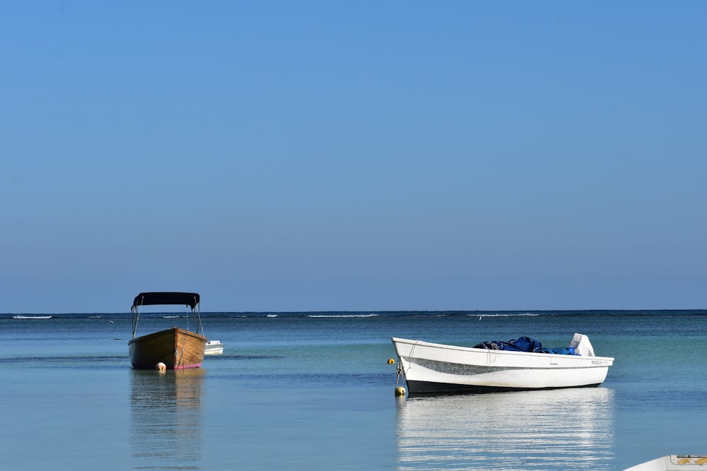 a boat sitting in the middle of a body of water