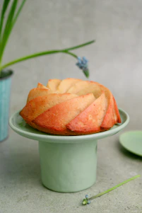 a cake sitting on top of a green cake plate