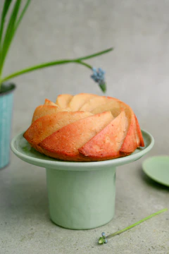 a cake sitting on top of a green cake plate