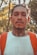 a man with tattoos on his face and a backpack