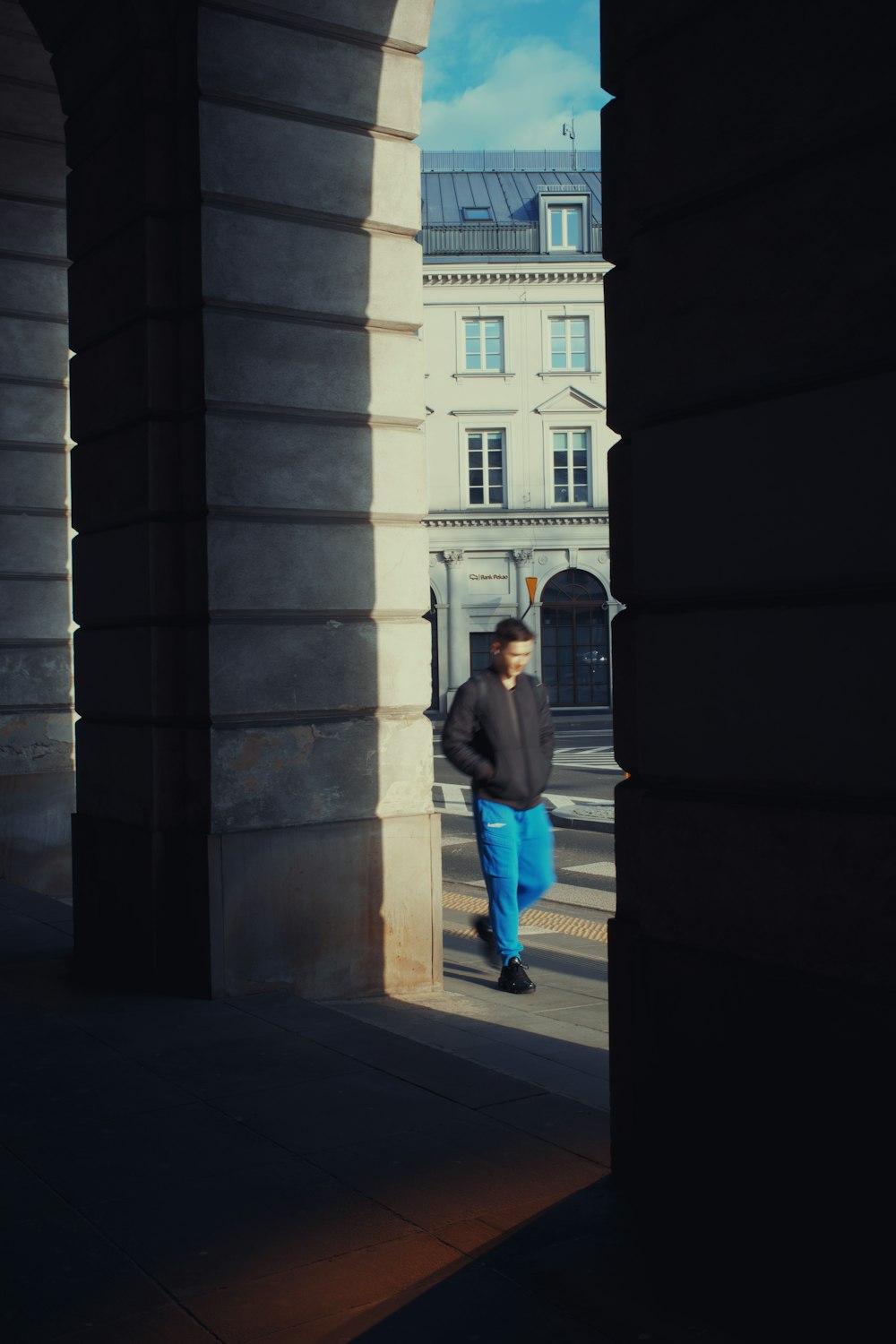 a man standing in a doorway of a building