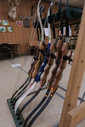 a rack of archery bows in a store