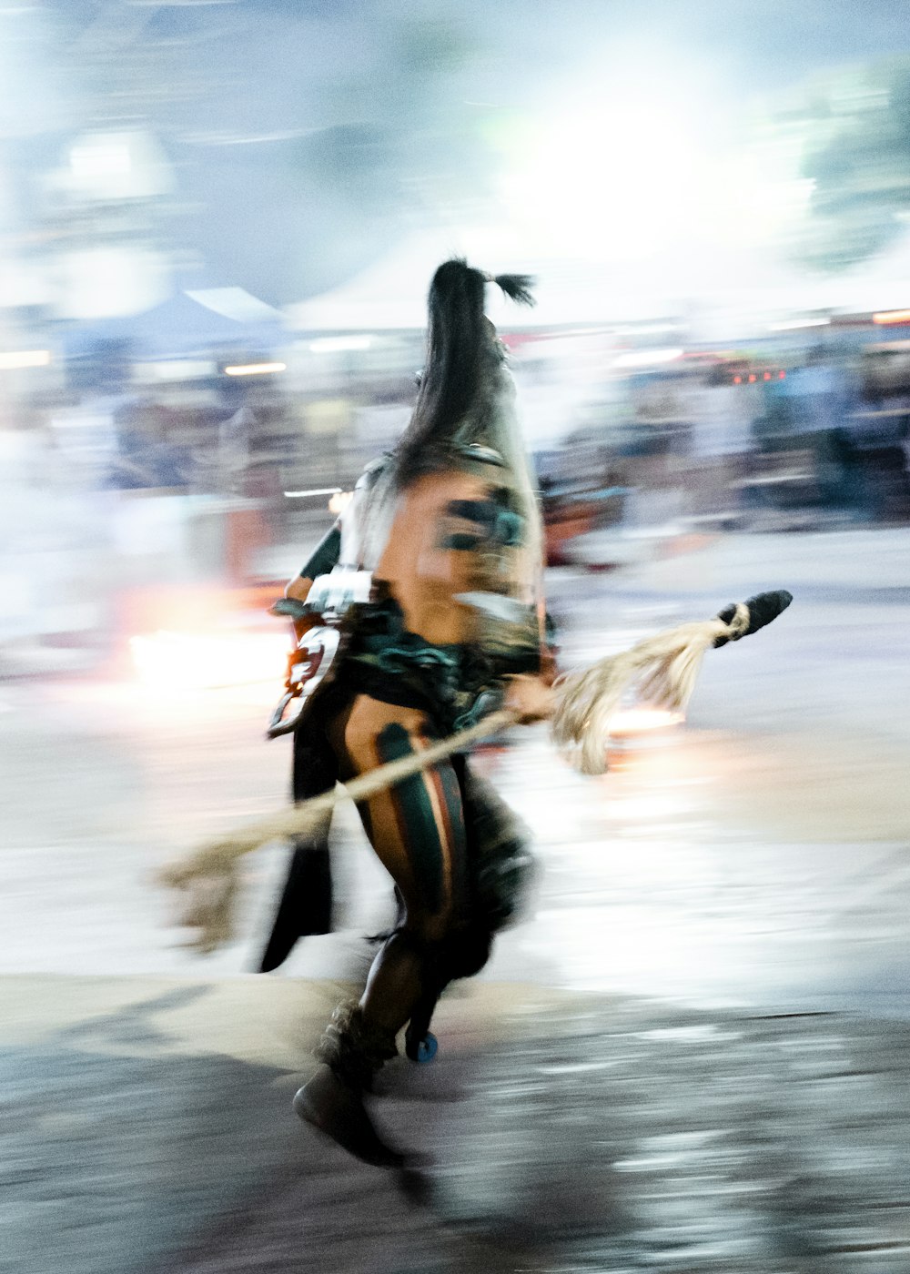 a man dressed as a native american walking down a street