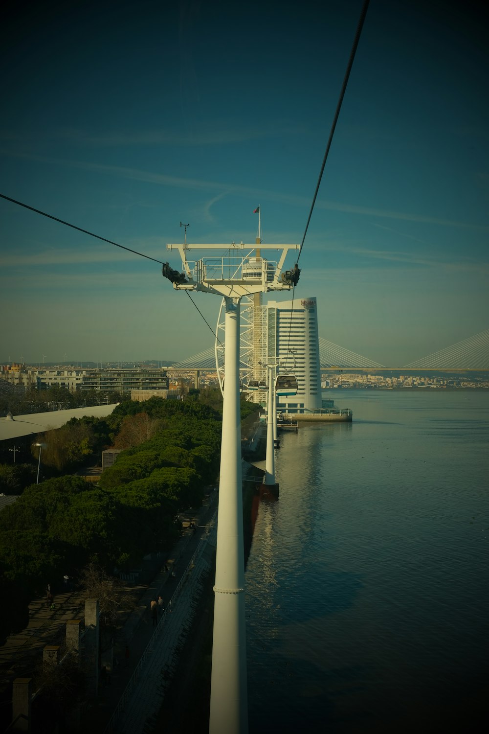 a cable car going over a body of water