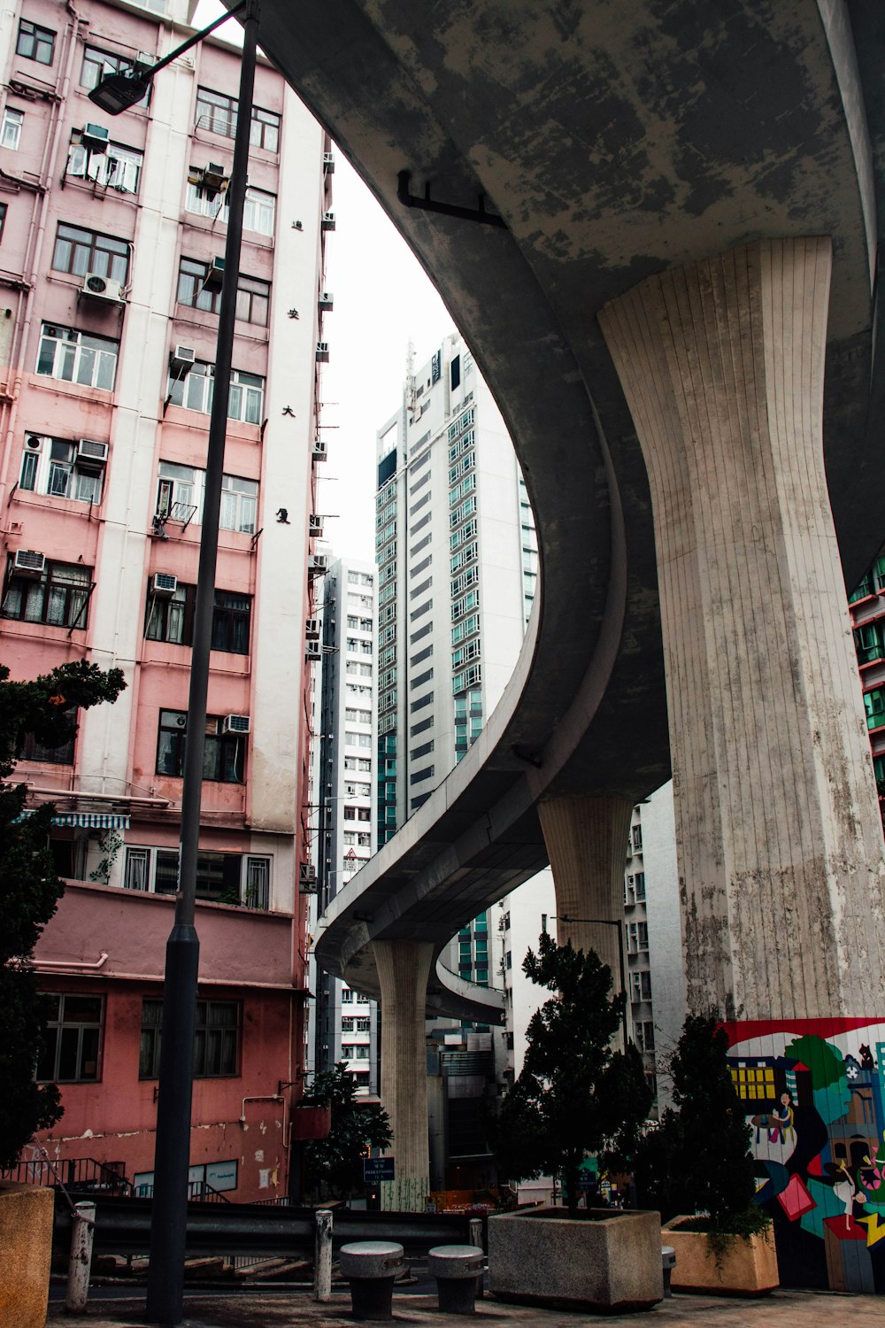 a very tall building next to some very tall buildings