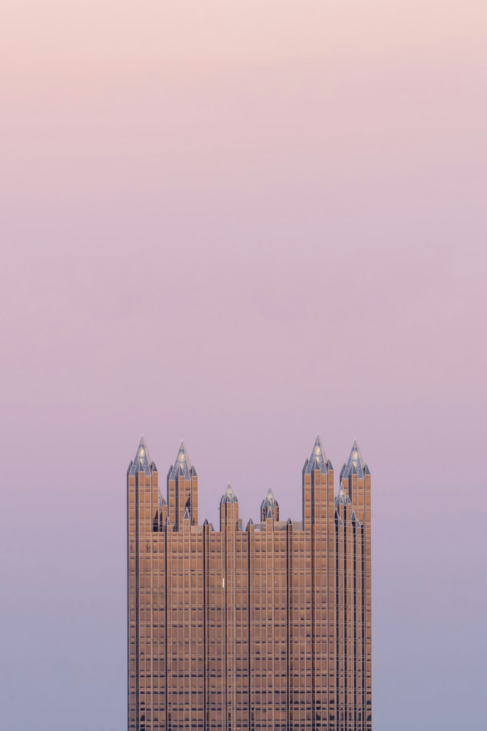 a very tall building sitting in the middle of a large body of water