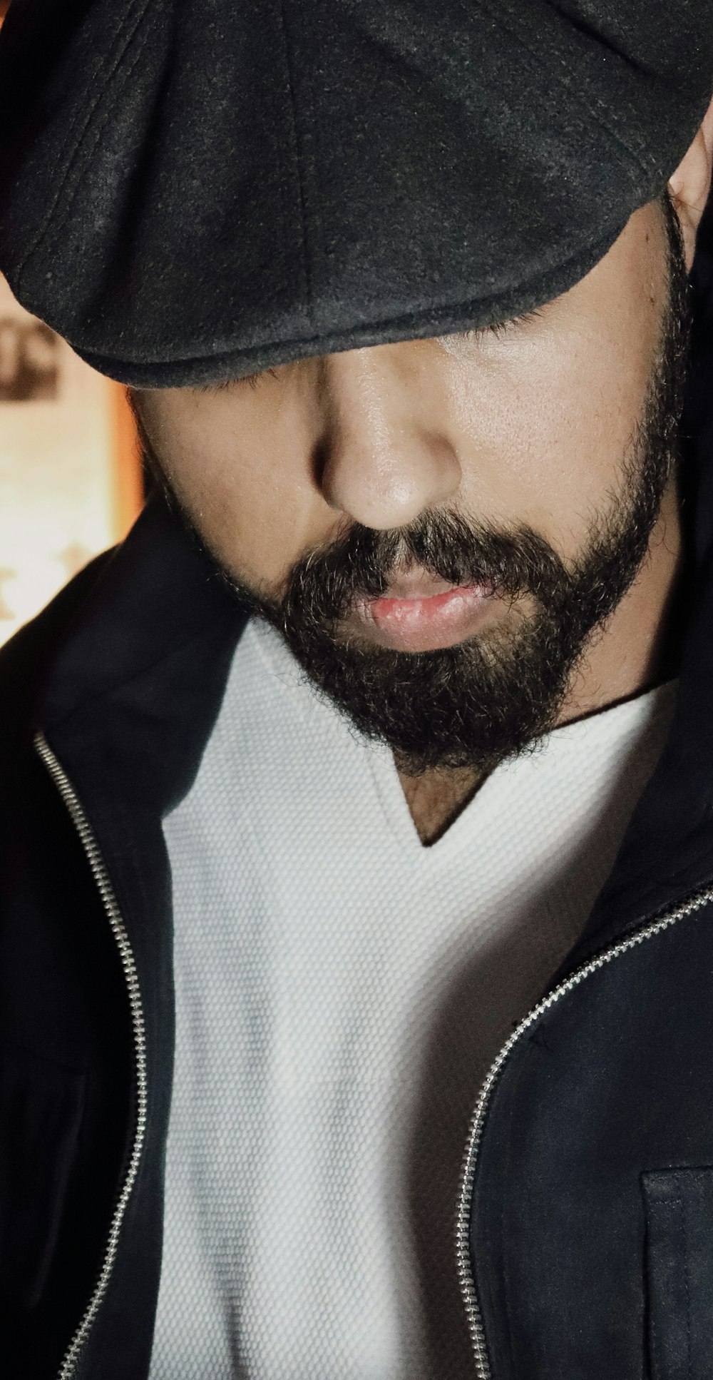 a close up of a person wearing a hat