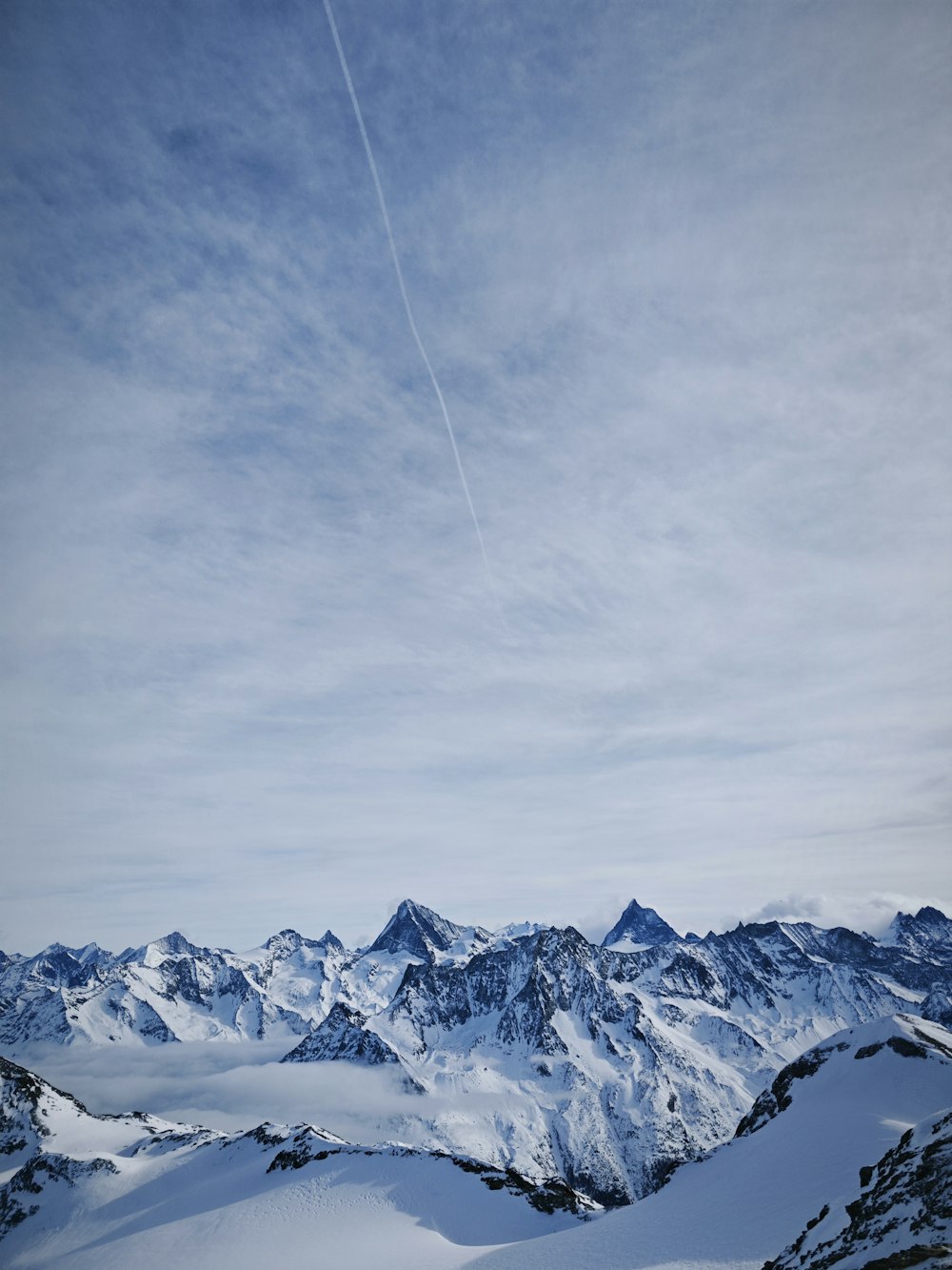 a person on skis on top of a snow covered mountain