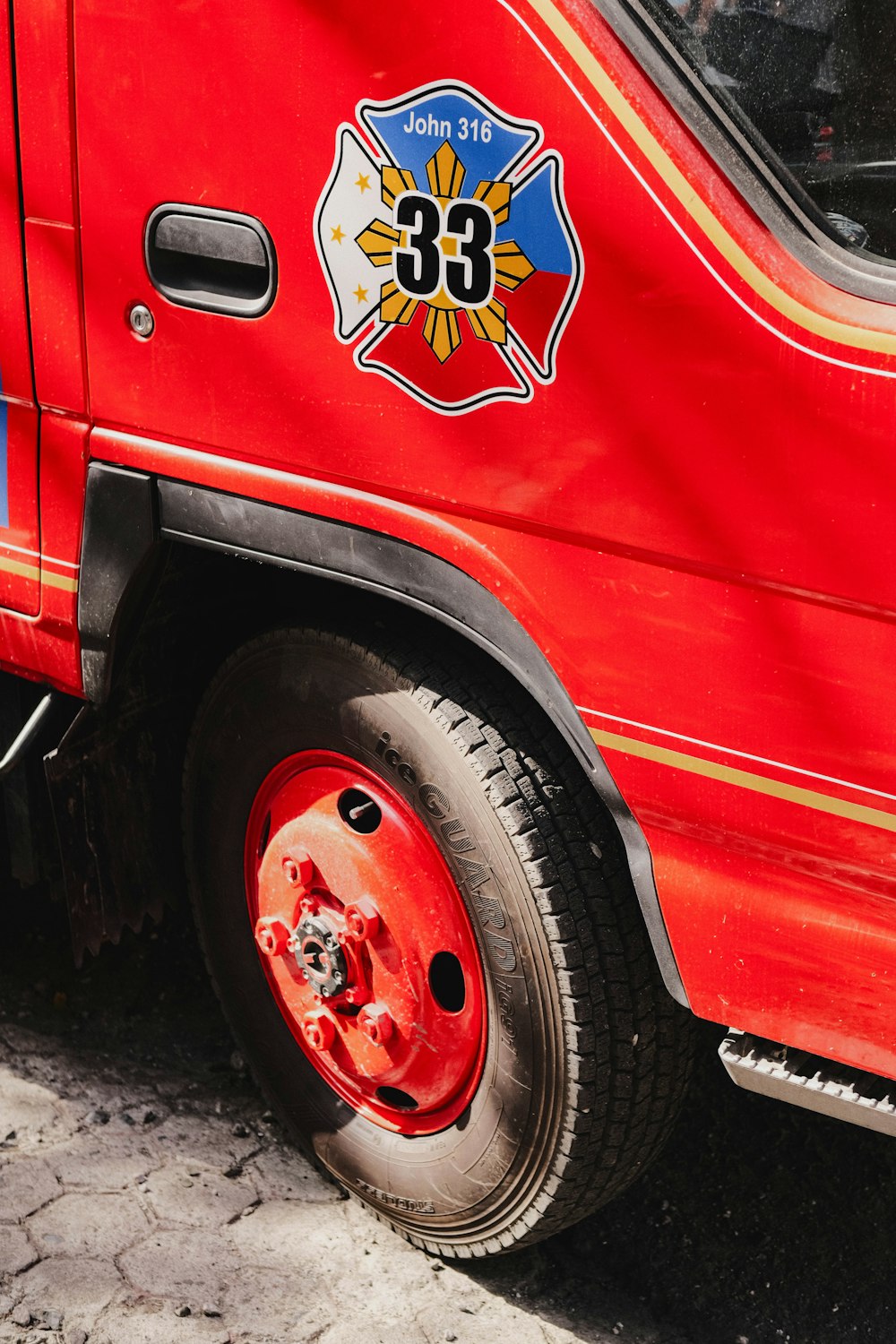 a red fire truck parked on the side of the road
