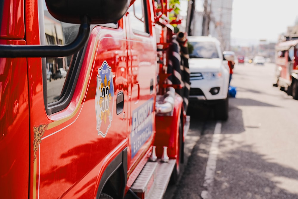 a red fire truck parked on the side of the road