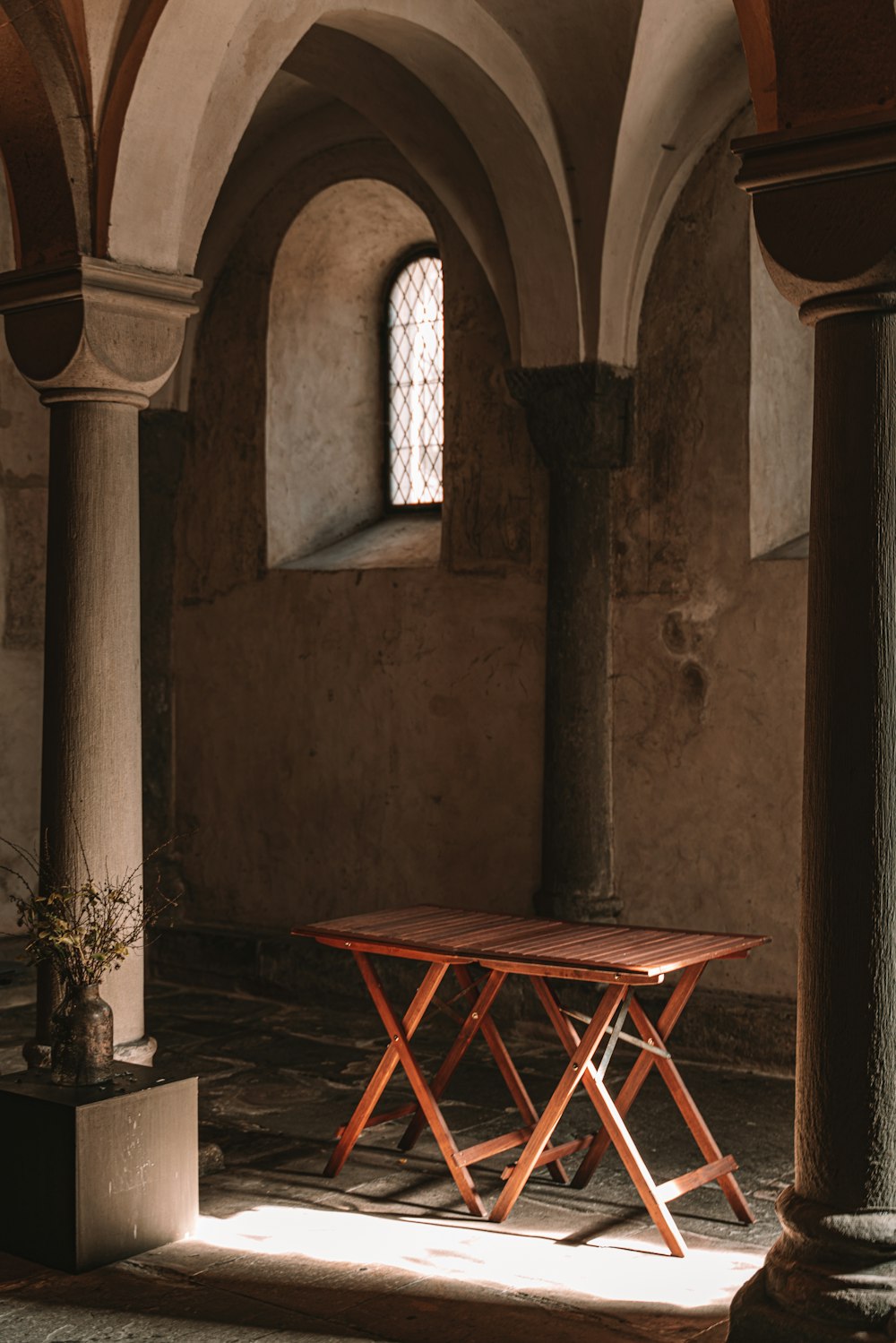 a wooden table sitting in the middle of a room