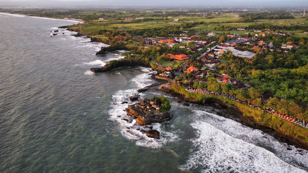 a bird's eye view of a small village by the ocean