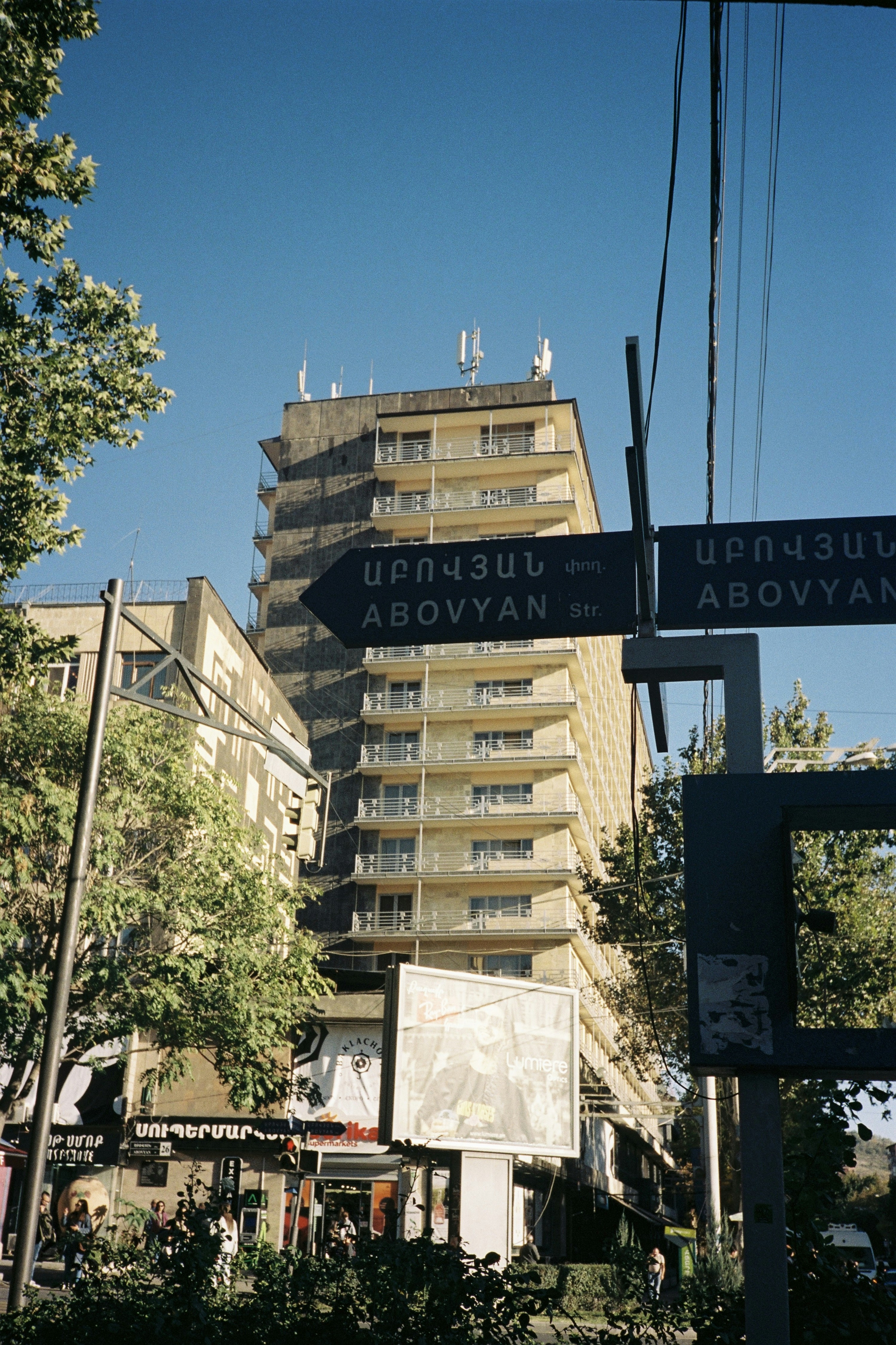 a street sign in front of a tall building