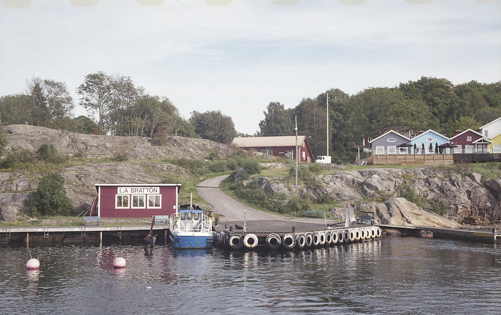 a boat is docked at a dock in the water