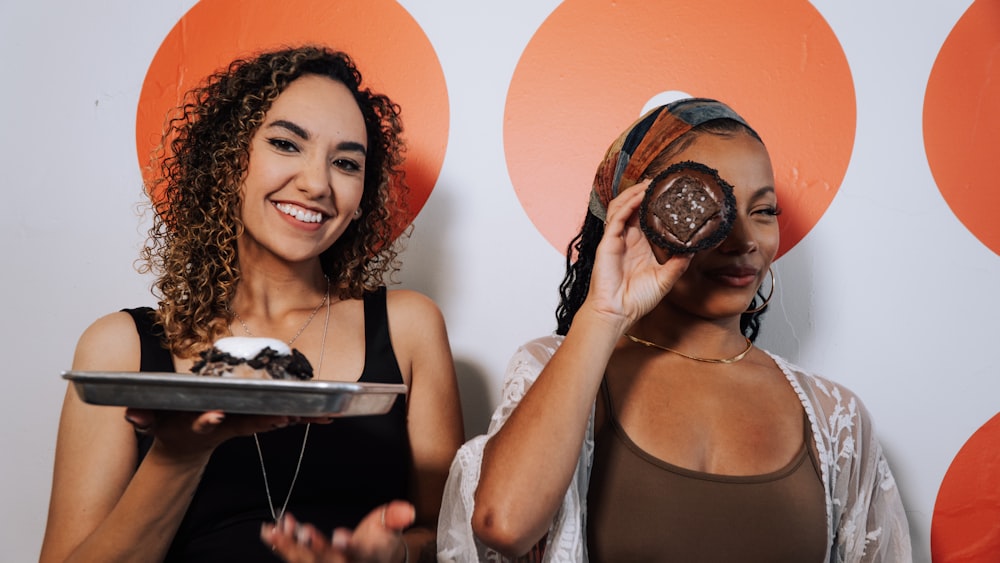 a couple of women standing next to each other