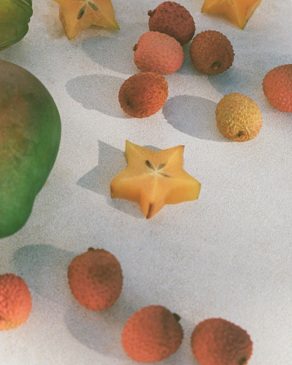 a group of fruit sitting on top of a table