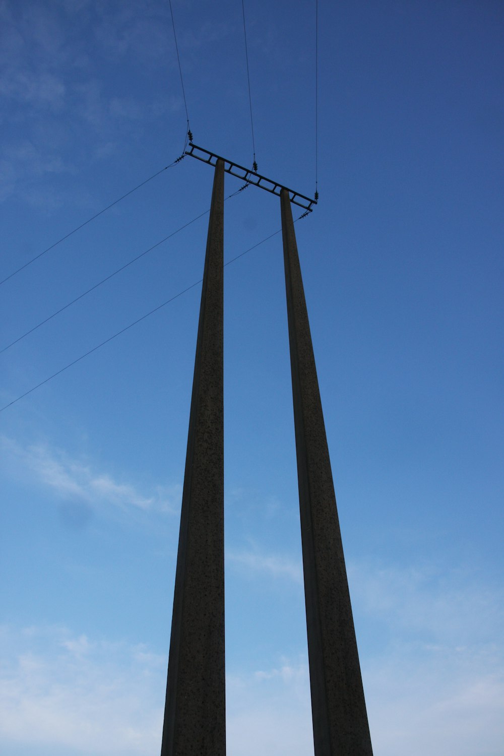 a couple of tall poles sitting next to each other