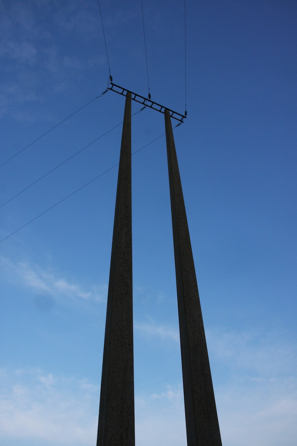 a couple of tall poles sitting next to each other