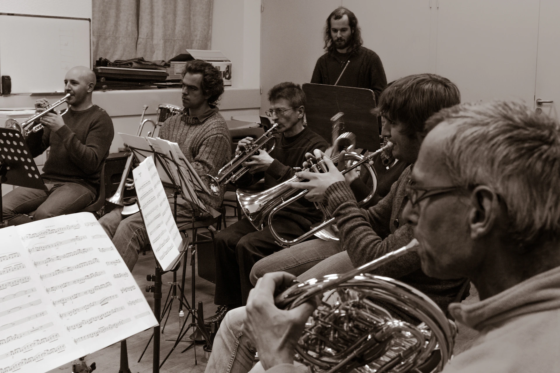 a group of men playing musical instruments in a room