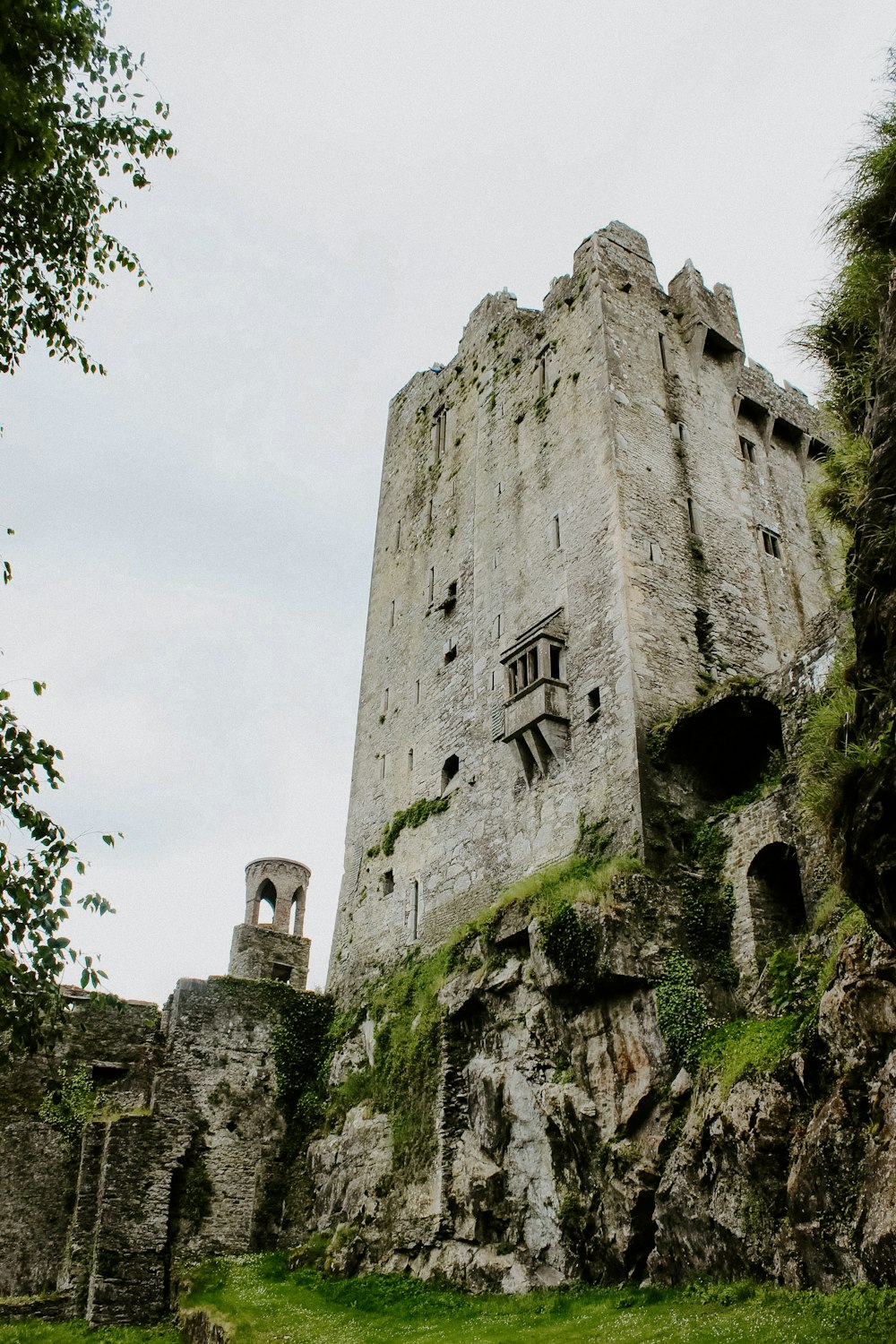 an old castle with a clock on the side of it