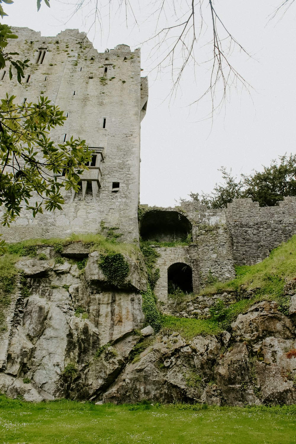 a stone castle with a door on the side of it