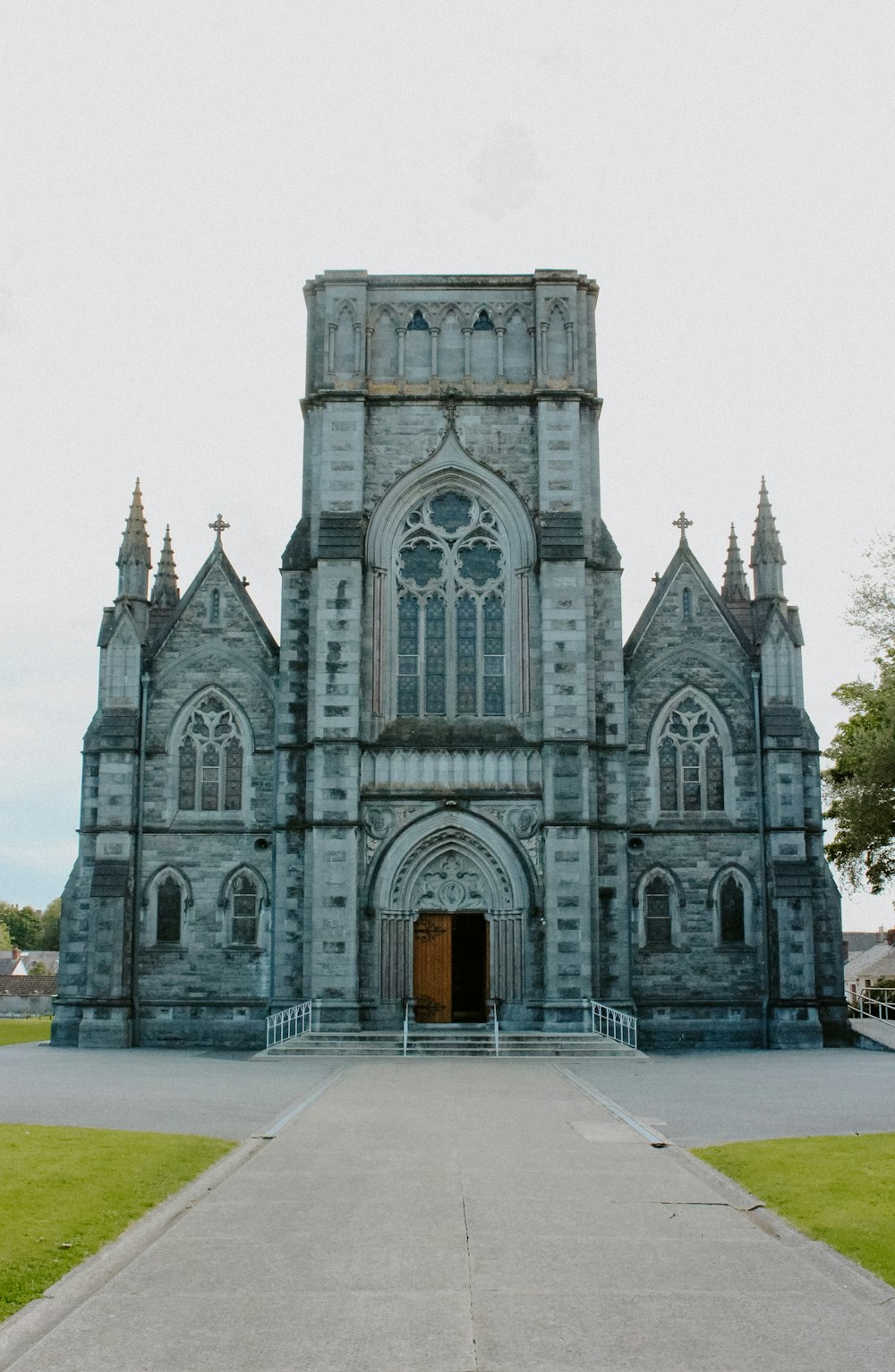 an old church with a walkway leading to it