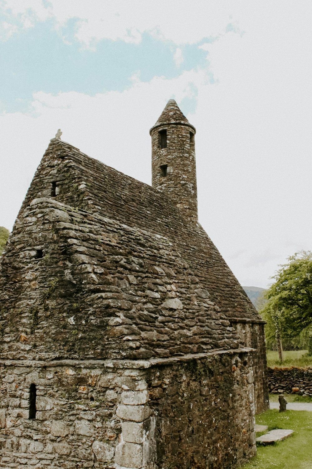 an old stone building with a clock tower