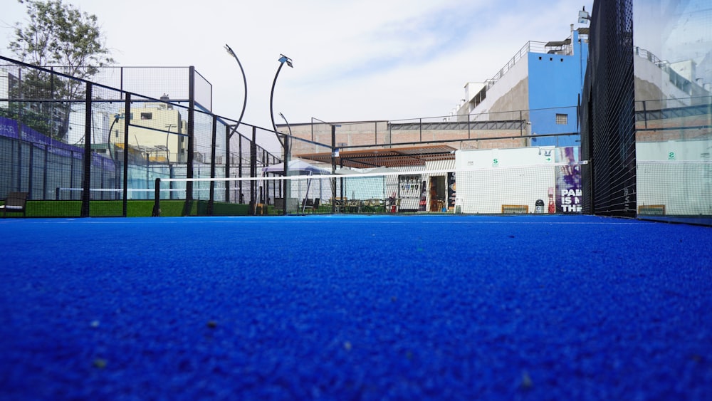 a tennis court with a net on the side of it