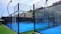 a tennis court with a fence surrounding it