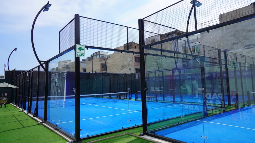 a tennis court with a fence surrounding it