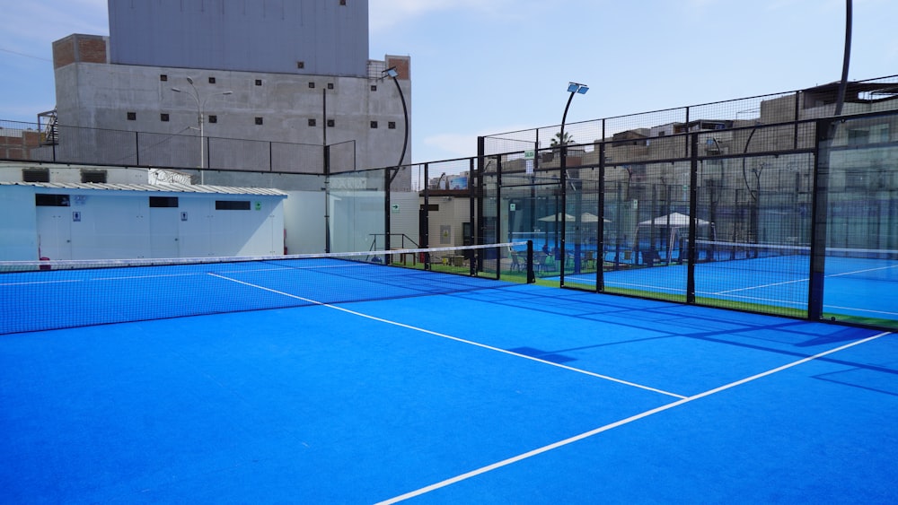 a blue tennis court with a white line on it