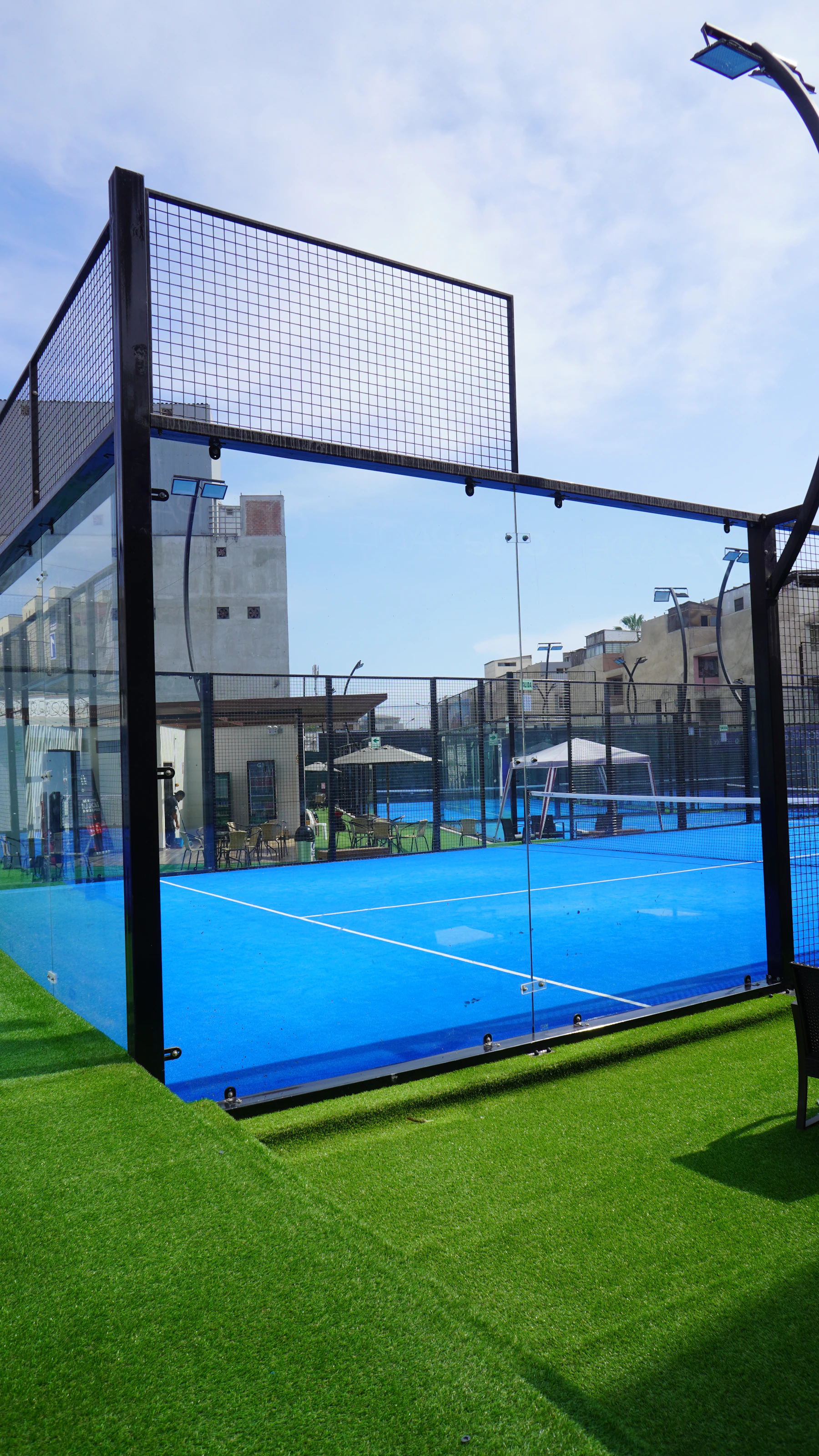 Padel court under floodlights