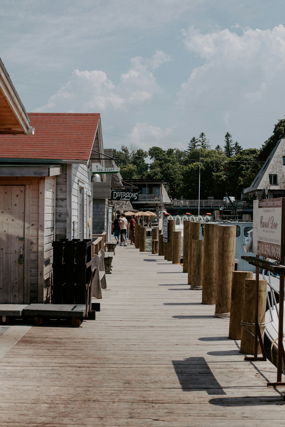 a row of wooden buildings sitting next to each other