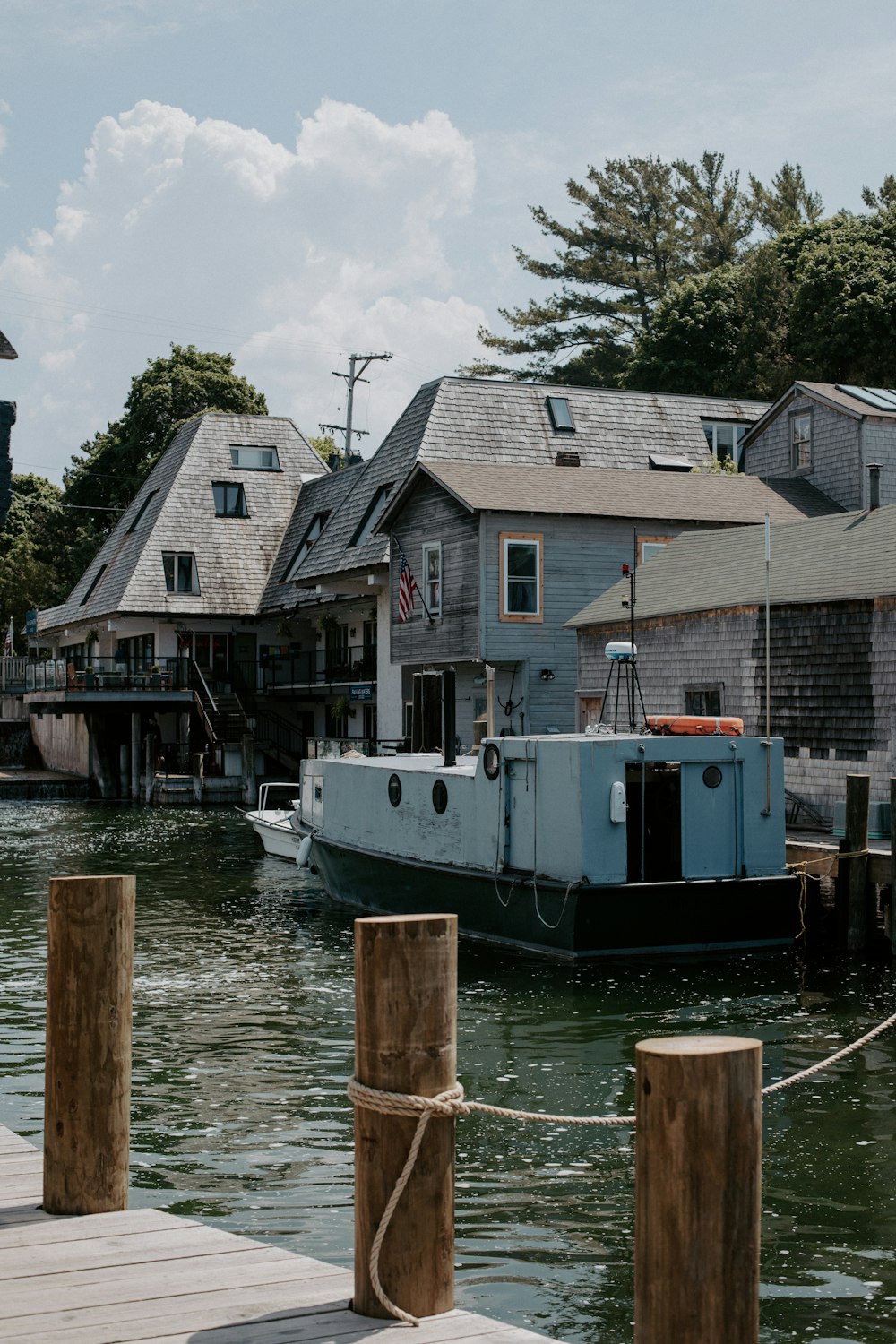 a boat is docked at a dock in the water