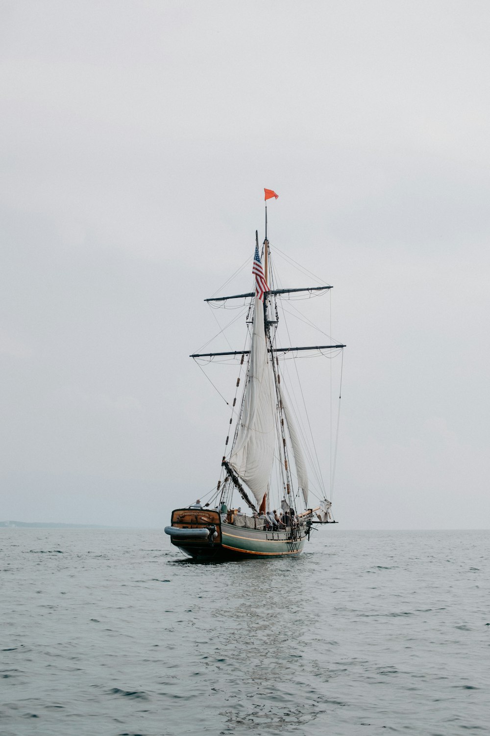 a sailboat in the middle of the ocean