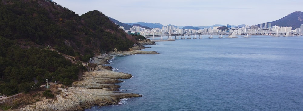 a large body of water with a city in the background