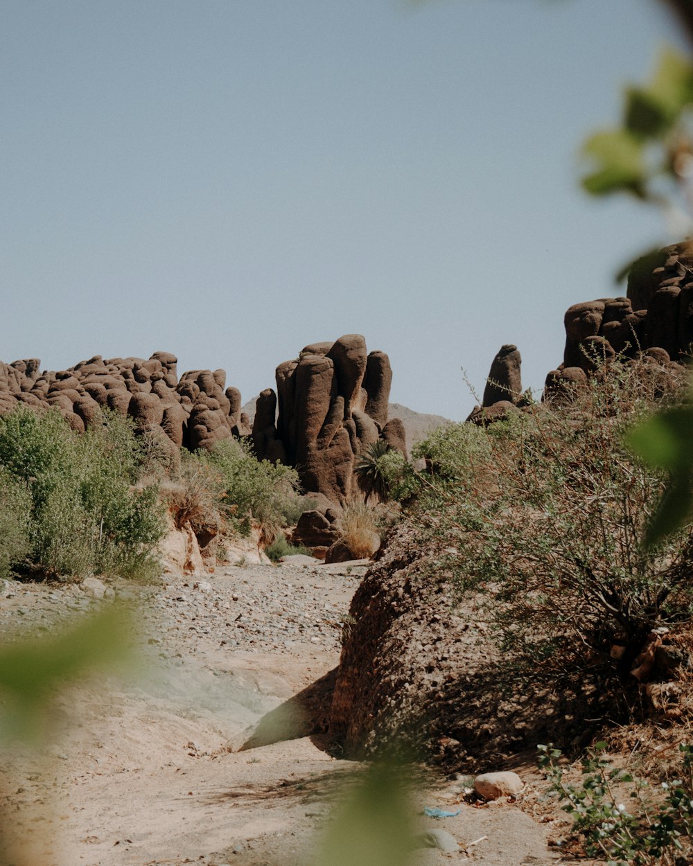 a group of large rocks in the middle of a desert