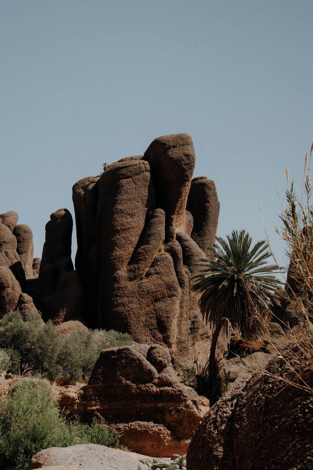 a large rock formation in the middle of a desert