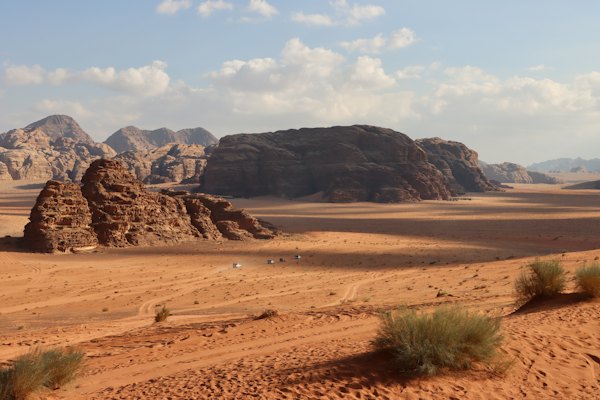 A desert landscape with mountains in the background — Wadi Rum, Jordan