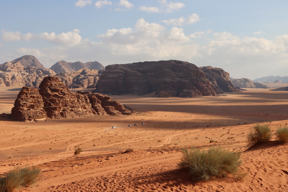 a desert landscape with mountains in the background