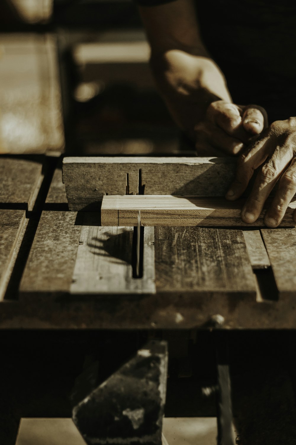 a person working on a piece of wood