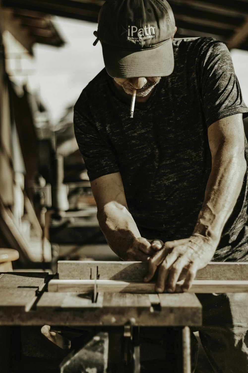 a man working on a piece of wood