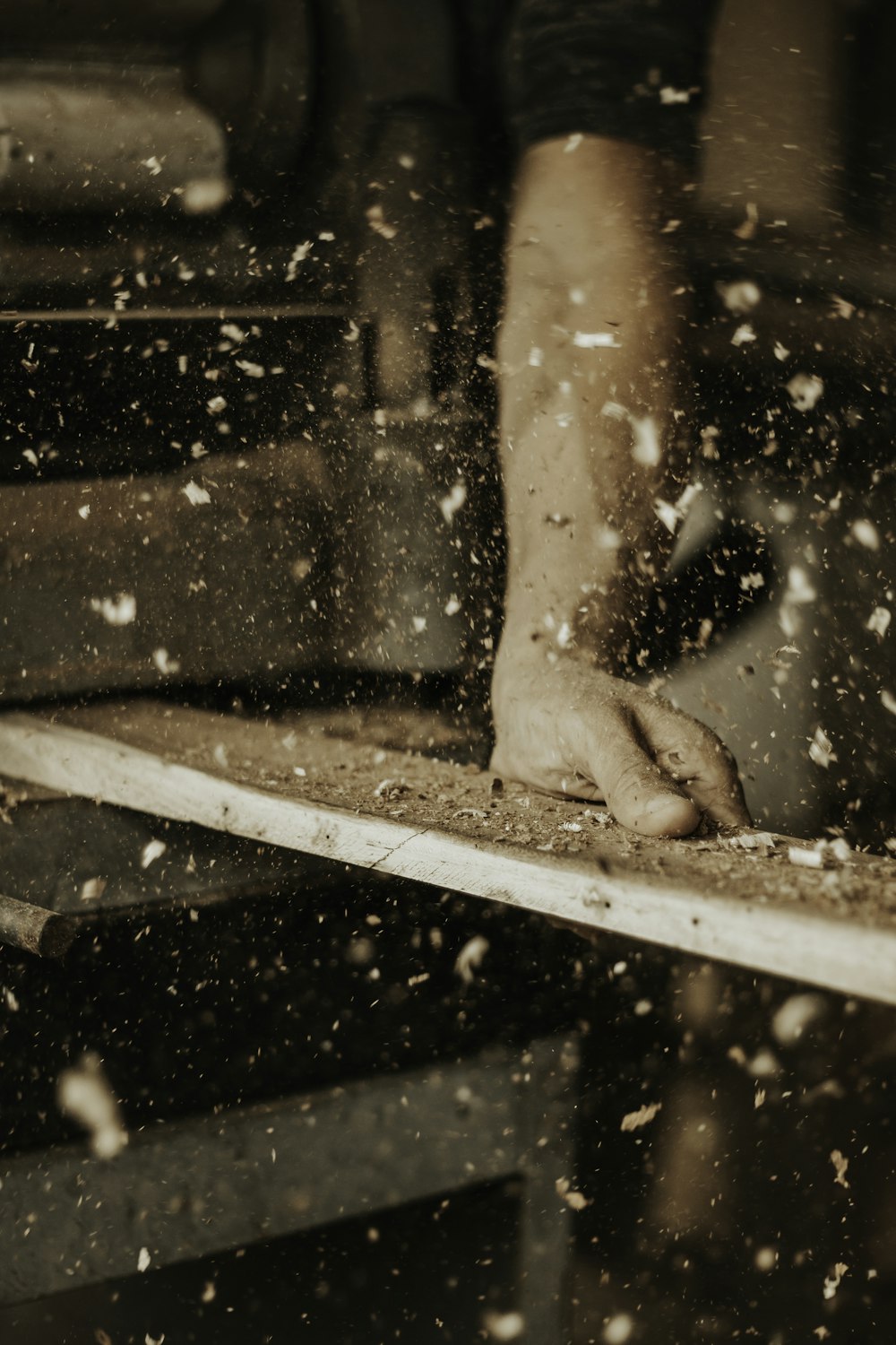 a person standing on top of a wooden table