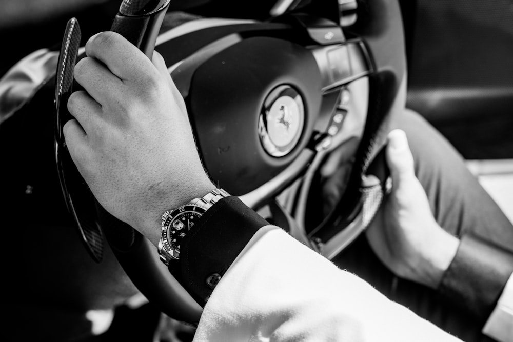 a close up of a person driving a car